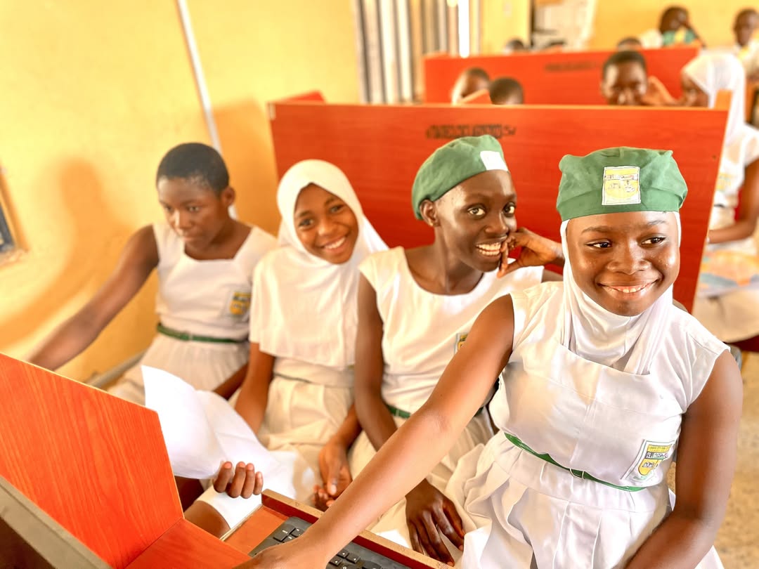 Students learning basic computer skills